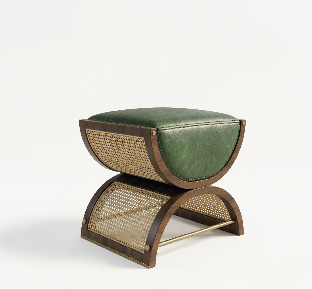 Dark wood stool with green leather seat, woven cane panels, and brass footrest