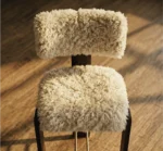 Modern wooden bar chair with cream shearling seat and brass footrest