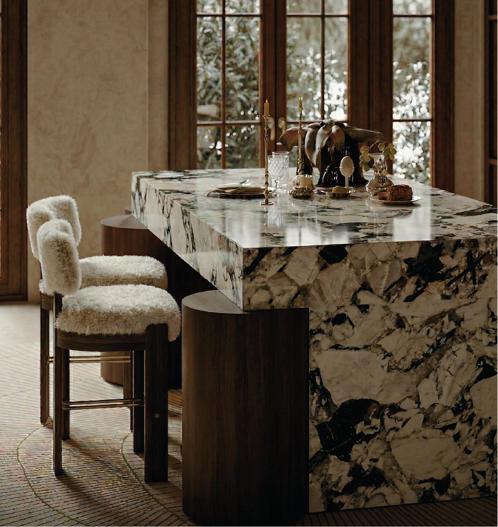 Luxury marble kitchen island with dark wood bar stools featuring cream shearling seats and brass footrests