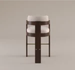 Luxury shearling bar chair with dark wood frame and brass footrest