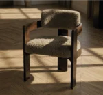Luxury dining chair with plush textured upholstery and dark wood frame