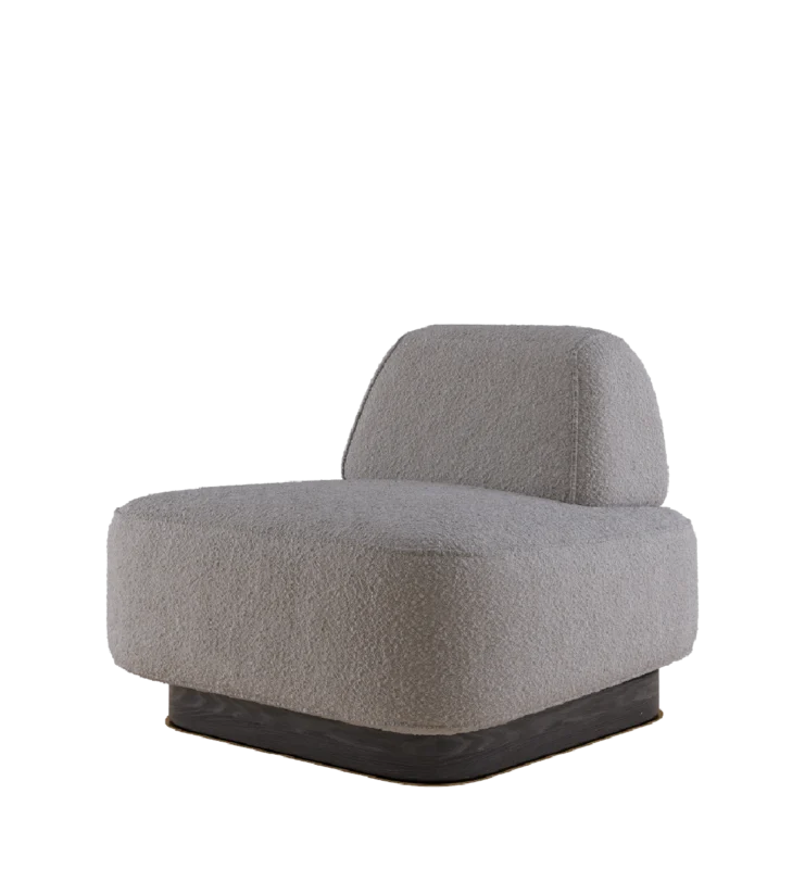 Modern boucle armchair with low profile and sculptural base