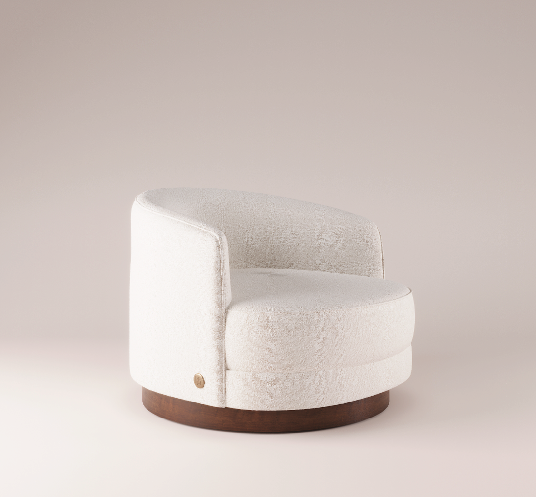 Mahler Armchair in a modern, minimalist style with soft texture and a wooden base, designed for contemporary living spaces.