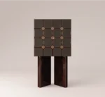 Geometric luxury cabinet with textured panels and dark wood base in contemporary design