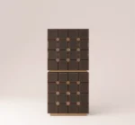 Stacked geometric cabinet in dark wood with textured panels and modular design