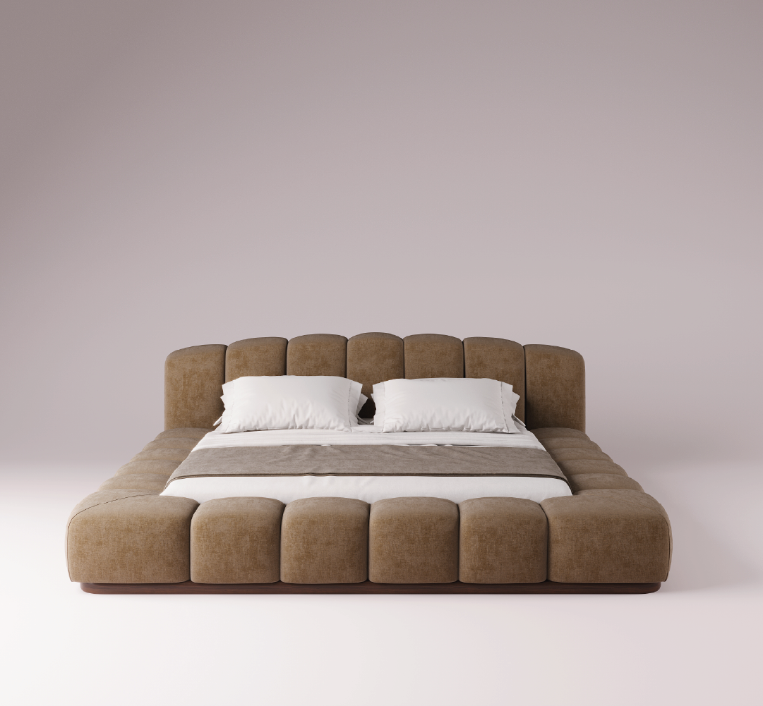 Kaija upholstered bed in soft beige fabric with sculptural padded frame and low-profile platform base.