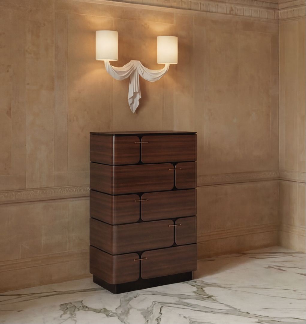 Walnut chest of drawers with curved design and brass handles in elegant marble interior