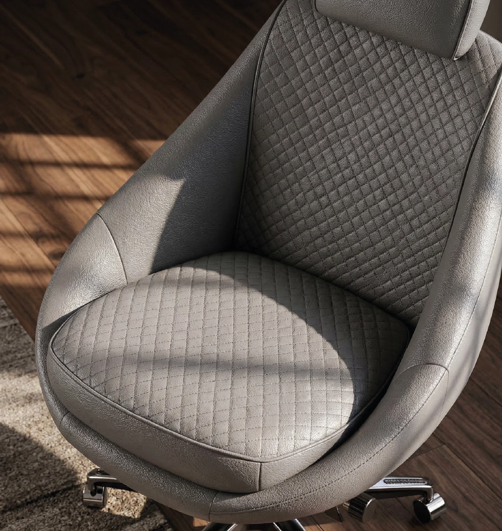 Close-up of quilted leather seat on luxury ergonomic office chair