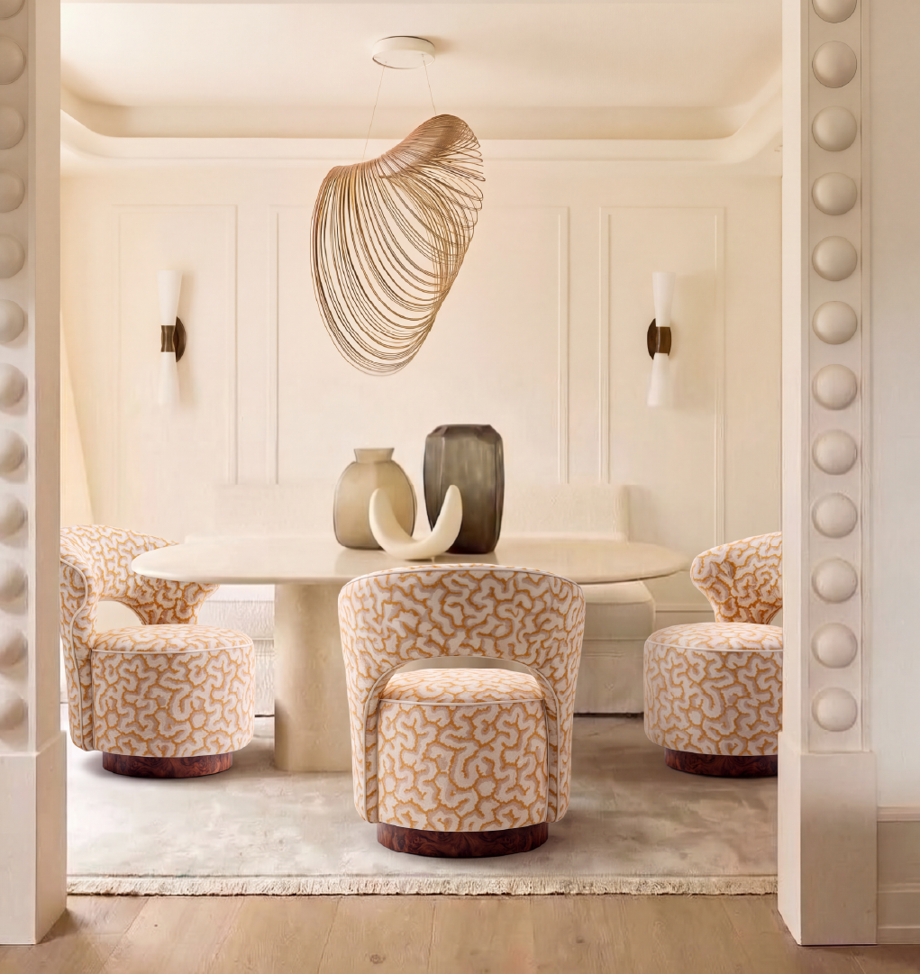 Bizet dining chairs in cream and gold patterned upholstery with walnut root wood bases in a luxury dining room