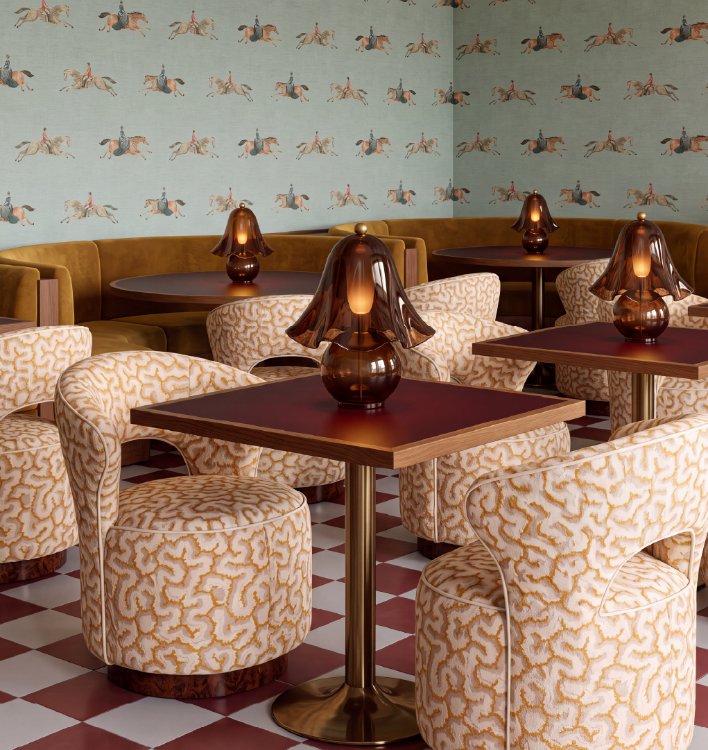 Bizet dining chairs in cream and gold patterned upholstery with walnut root wood bases in a boutique dining interior