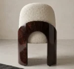 Fauré dining chair with cream bouclé upholstery and curved walnut root wood side panels