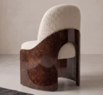 Fauré dining chair with cream bouclé upholstery and curved walnut root wood side panels