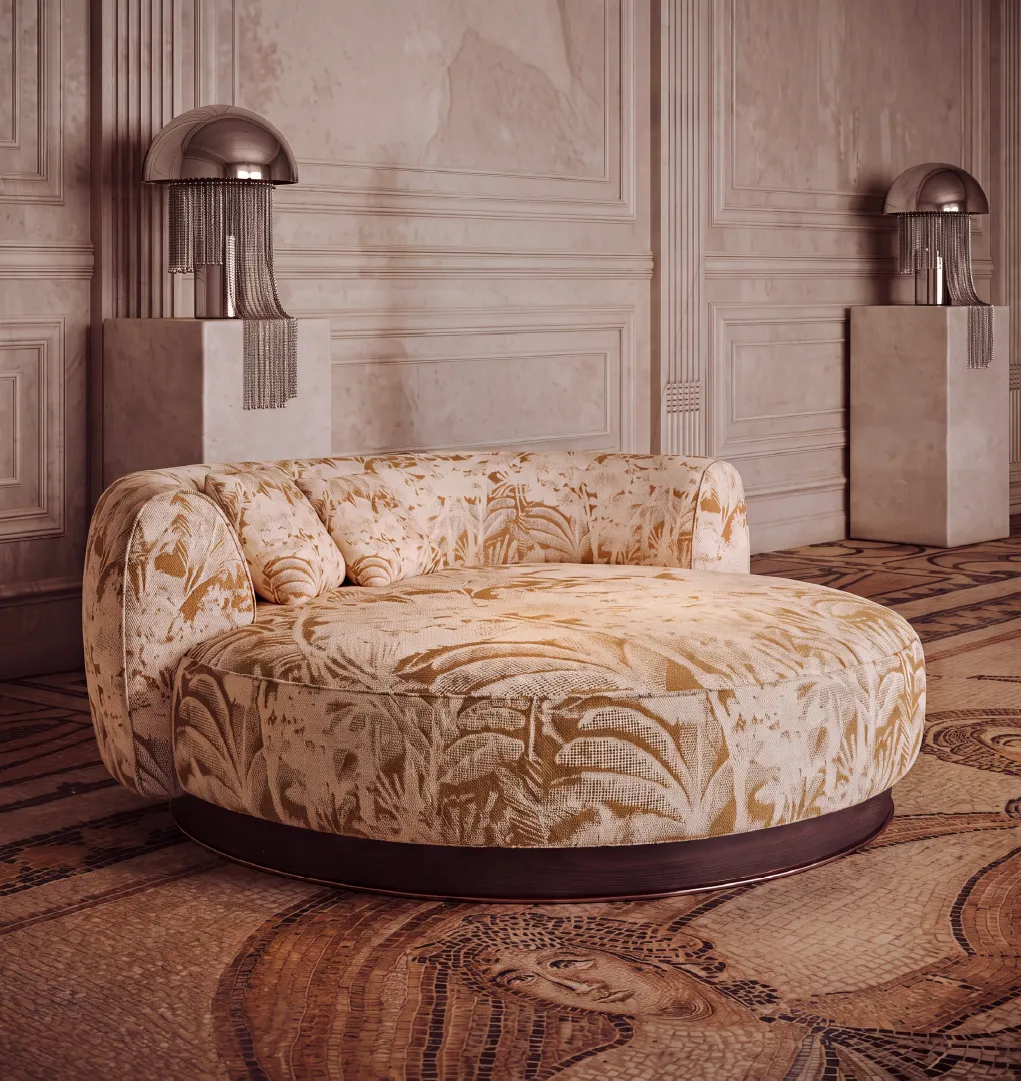 Hedy chaise lounge in cream and gold botanical upholstery with dark walnut wood base in a luxury interior
