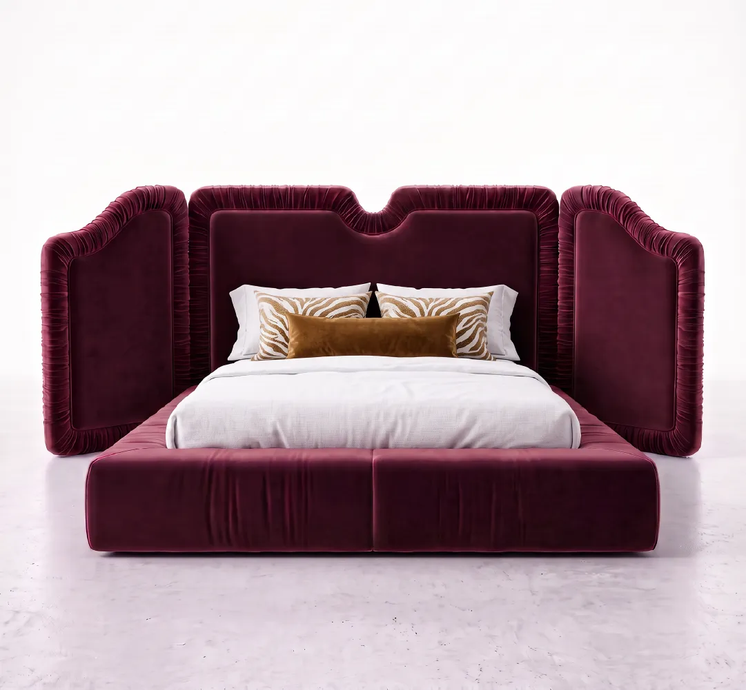 Luxury upholstered bed in burgundy velvet with sculptural winged headboard and platform base